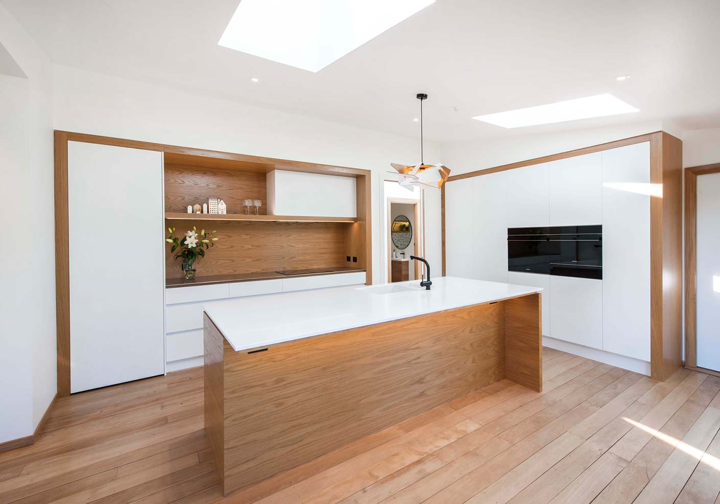 White and wood grain kitchen